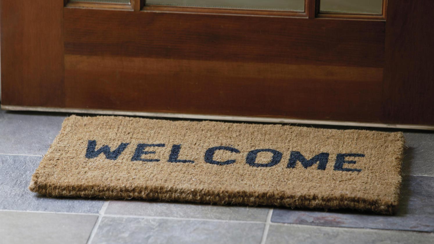 Welcome mat in front of door